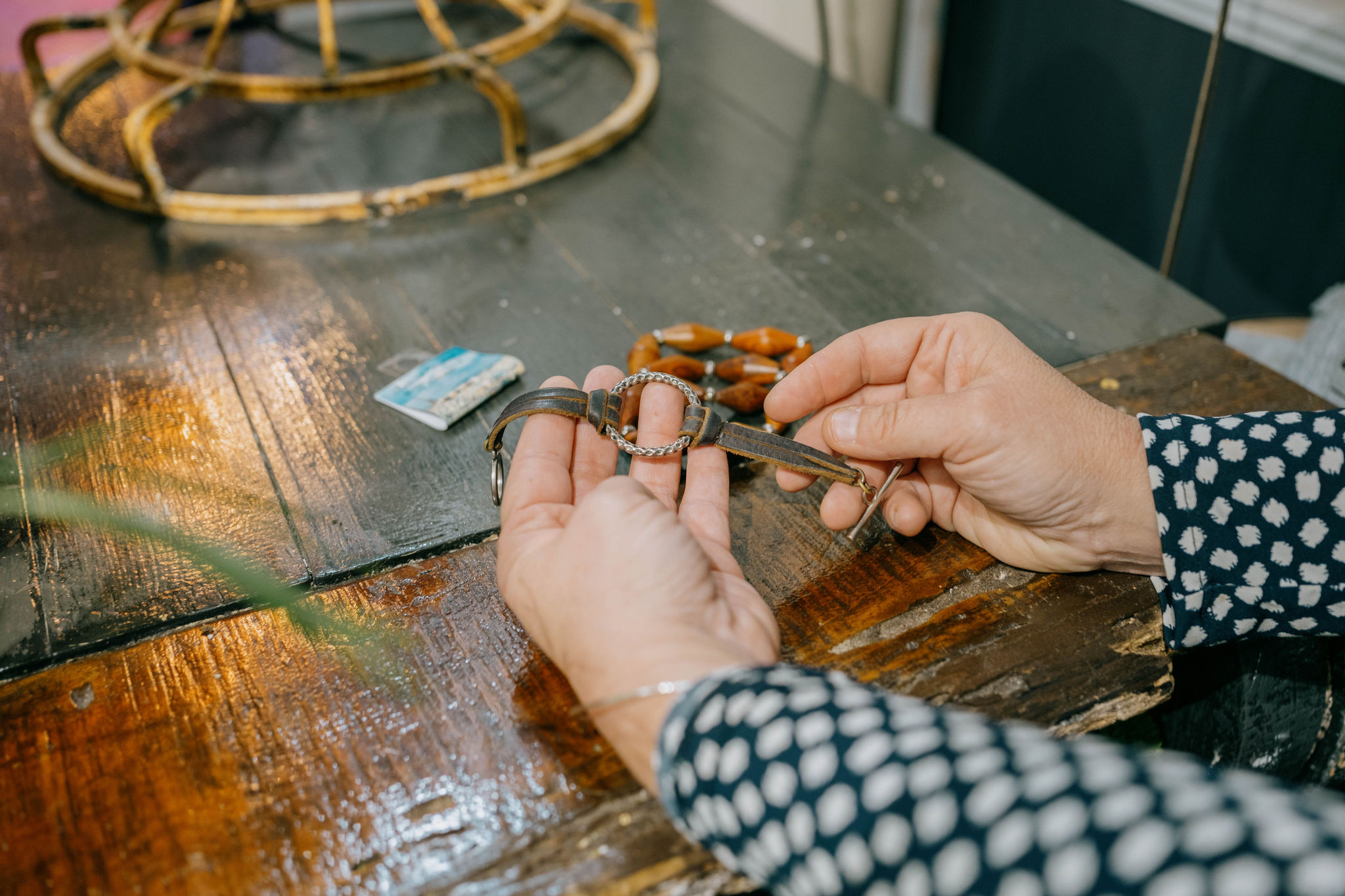 Woman's hand touching jewelry 